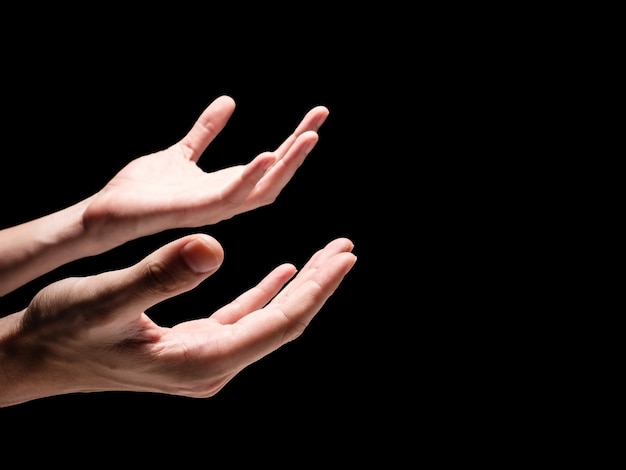 Premium Photo | Male hands on a black background. free space for text