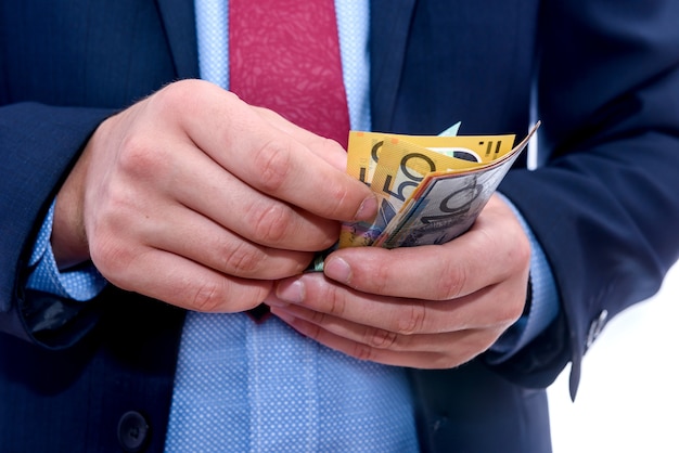 premium-photo-male-hands-counting-australian-dollar-banknotes-close-up