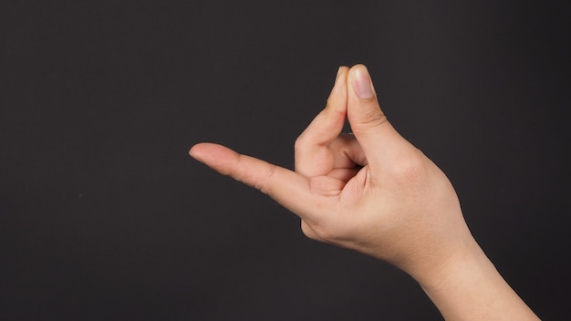 Premium Photo | Male model is doing snap gesture hand sign on black ...