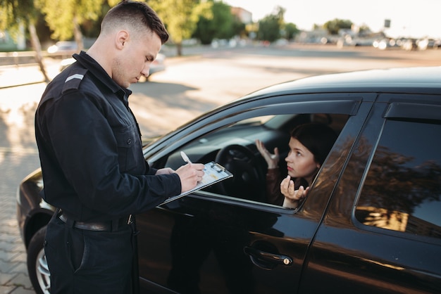 Premium Photo Male Police Officers Check Vehicle On The Road