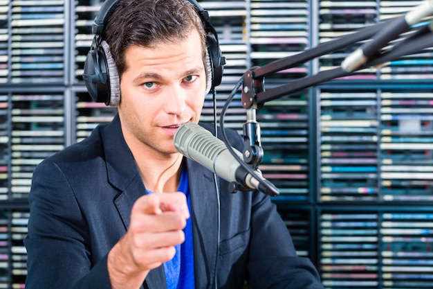 Premium Photo | Male radio presenter in radio station on air