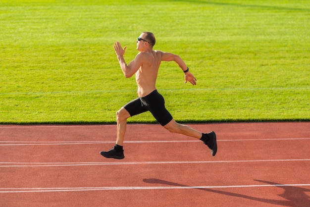 Premium Photo | Male runner on the track