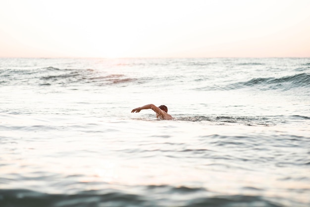 Free Photo | Male swimmer swimming in the ocean