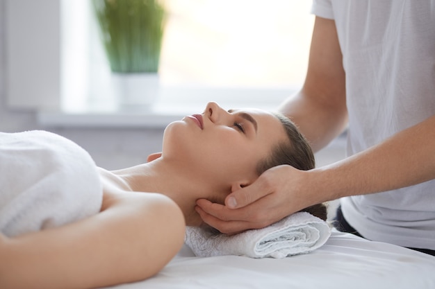 Premium Photo Male Therapist Making Head Massage To Female Client