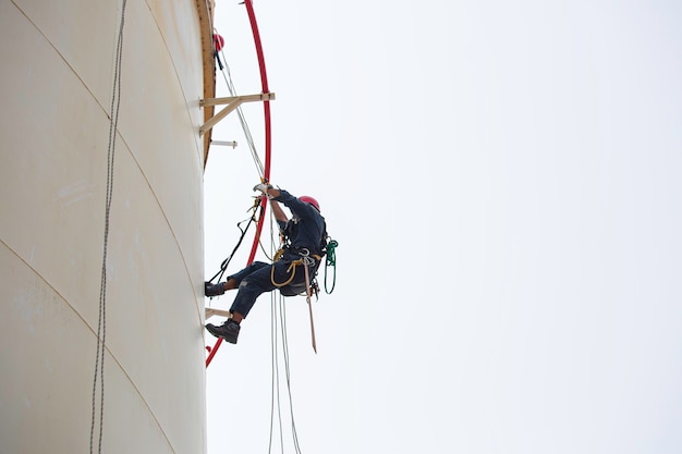 Premium Photo | Male worker industrial rope access welder working at ...