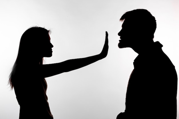 Premium Photo | Man abusing woman, silhouette on a white background.