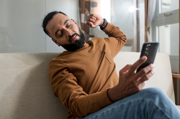 free-photo-man-being-tired-after-spending-time-on-his-smartphone