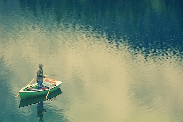 Free Photo | Man in a boat on the lake