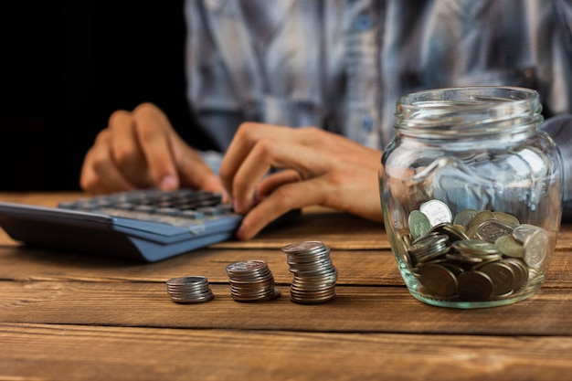 Man calculating monthly savings Free Photo