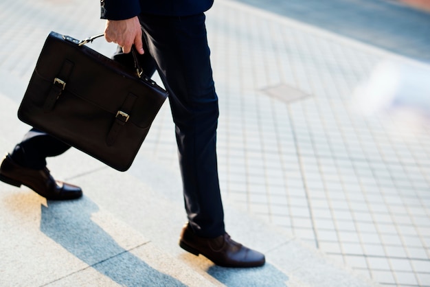 Premium Photo | Man carrying his bag to work