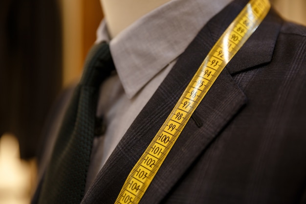 Man checking the measures of his suit | Free Photo