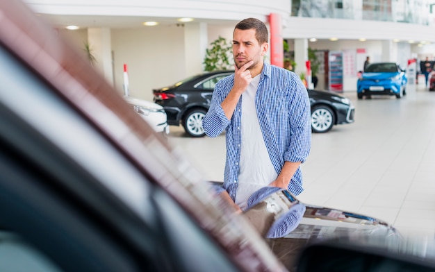 Free Photo Man Checking Out New Car