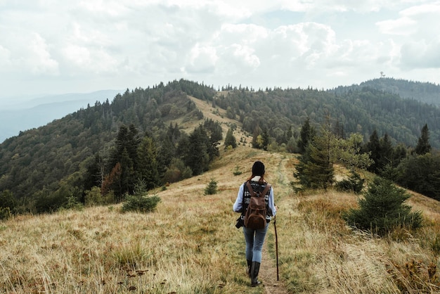 Premium Photo | Man climbing a hill