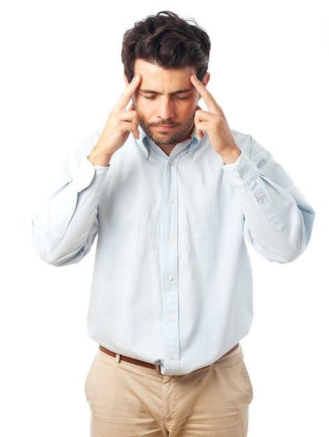 Premium Photo | Man concentrating with fingers on temple on a white ...