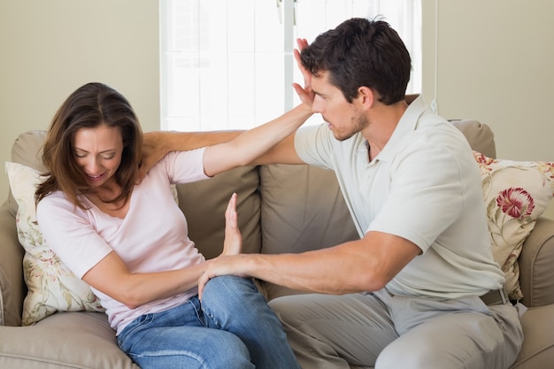 Premium Photo | Man consoling a sad woman in living room