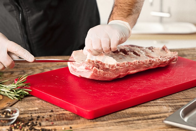 Free Photo Man Cooking Meat Steak On Kitchen