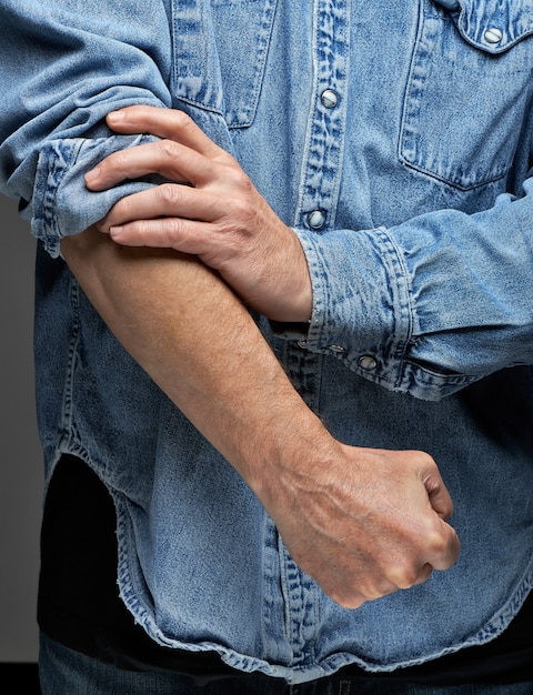 men rolling up sleeves