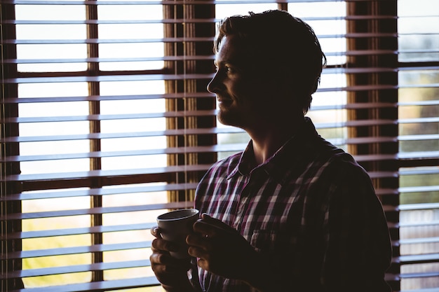 Premium Photo | Man drinking a coffee alone