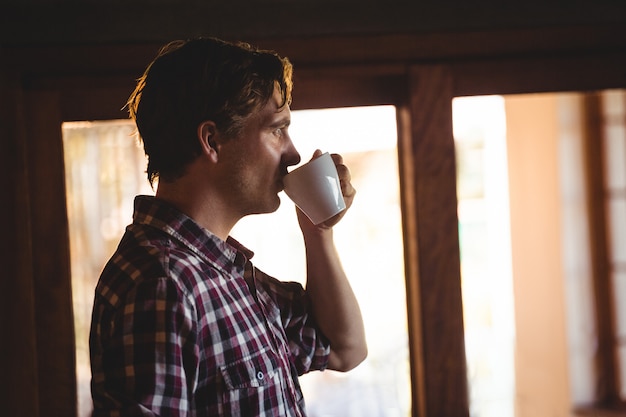 Premium Photo | Man drinking a coffee alone