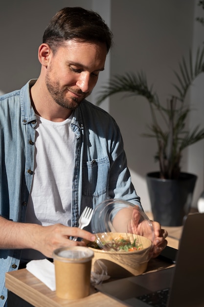 Free Photo | Man enjoying takeaway food