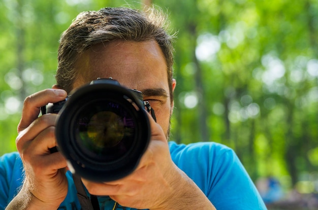 Premium Photo | Man face covered with camera lenses.young guy holding ...