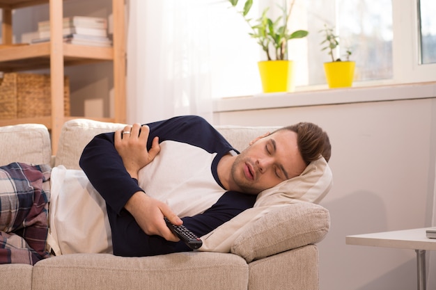 premium-photo-man-falling-asleep-at-home-while-watching-tv