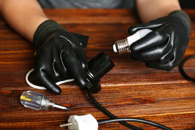 Man Fixing Desk Lamp Wires, How To Repair A Broken Table Lamp