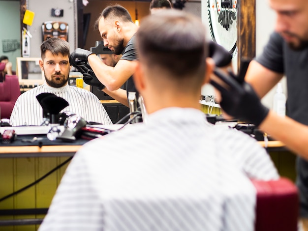 Free Photo | Man getting a new haircut from behind