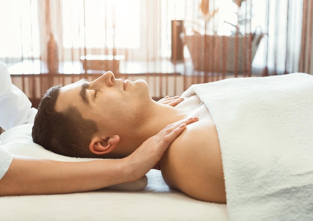 Premium Photo Man Getting Shoulders Massage In Spa Centre