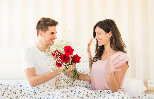 man give flower to girl