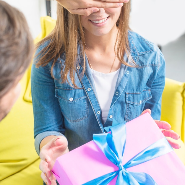 Man Giving Surprise Gift To His Girlfriend Free Photo