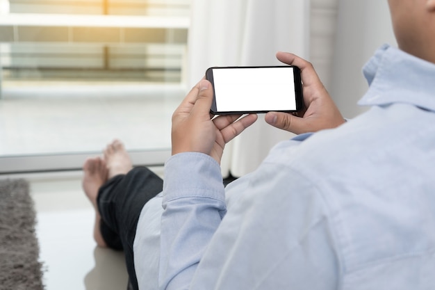 Download Man hand holding the black smartphone screen mockup | Premium Photo