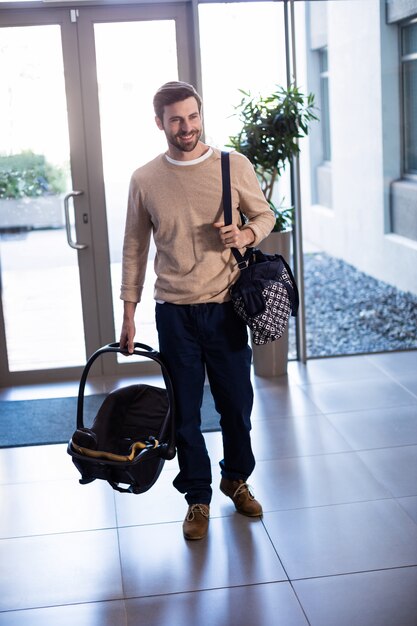 man with baby carrier