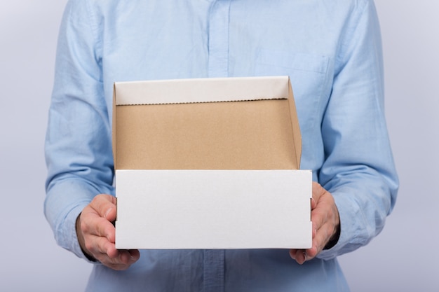 Download Premium Photo Man Holding Cardboard Boxes Front View Parcel Delivery Home Express Delivery