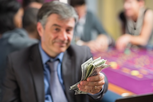 Premium Photo | Man holding out money