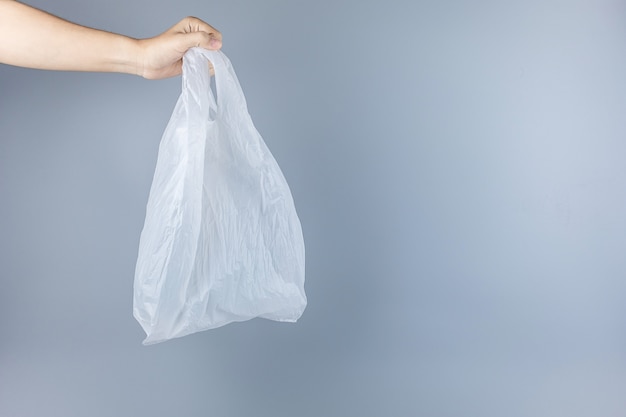 Premium Photo | Man holding plastic bag with copy space for text ...