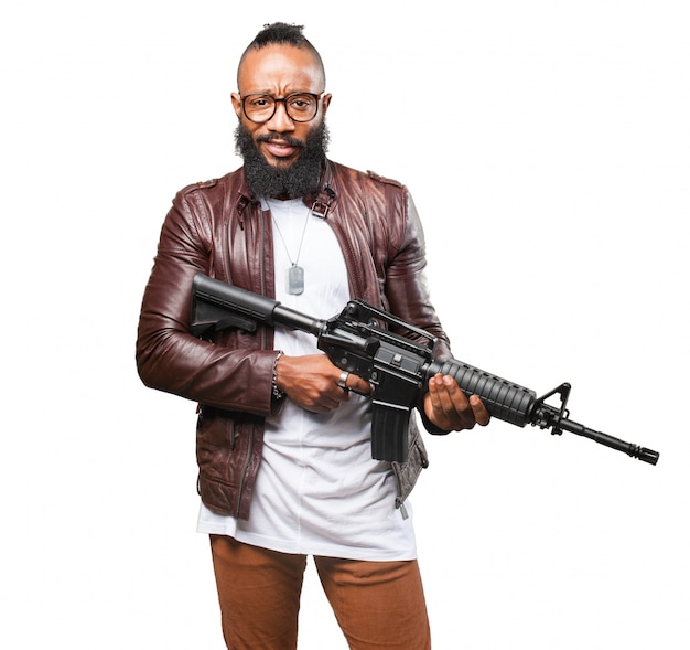 Free Photo | Man holding a submachine gun