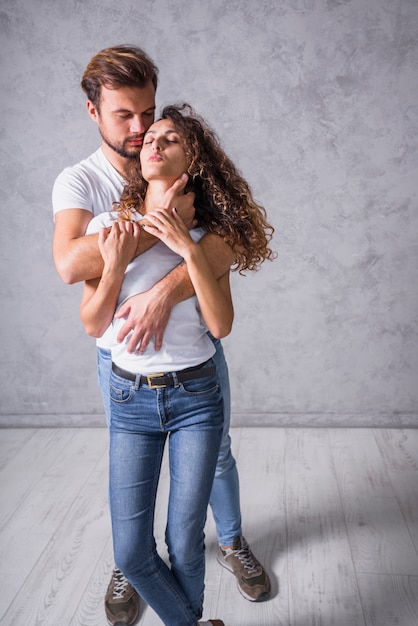 Free Photo Man Hugging Woman From Behind
