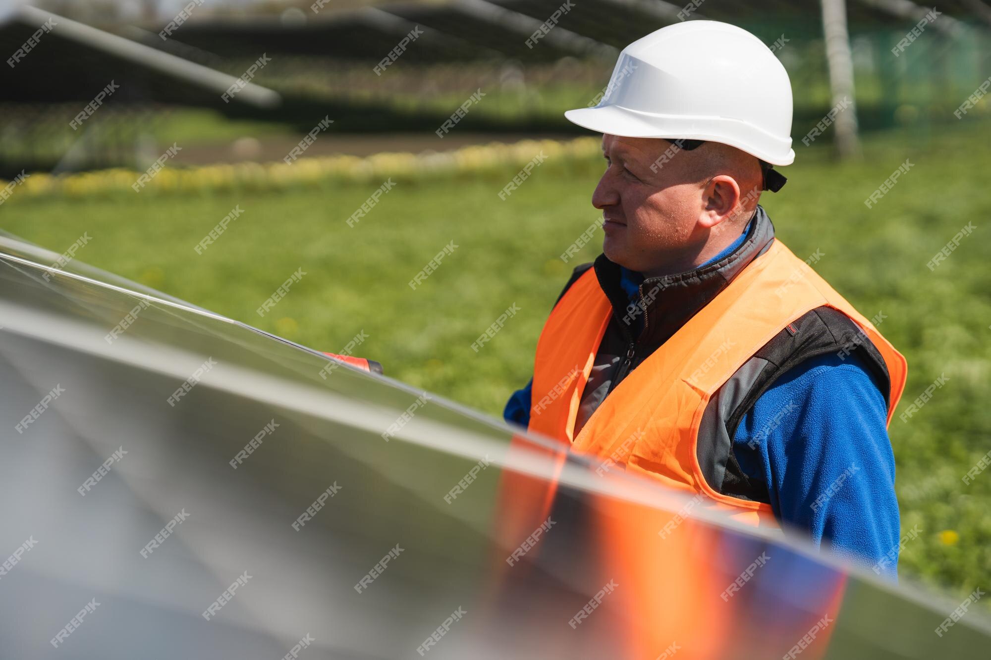 premium-photo-man-inspecting-panels-at-a-solar-power-plant