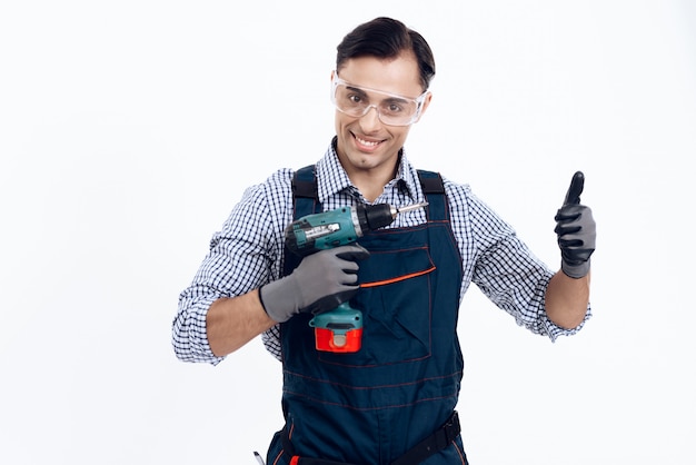 Premium Photo | A man is posing with a screwdriver.