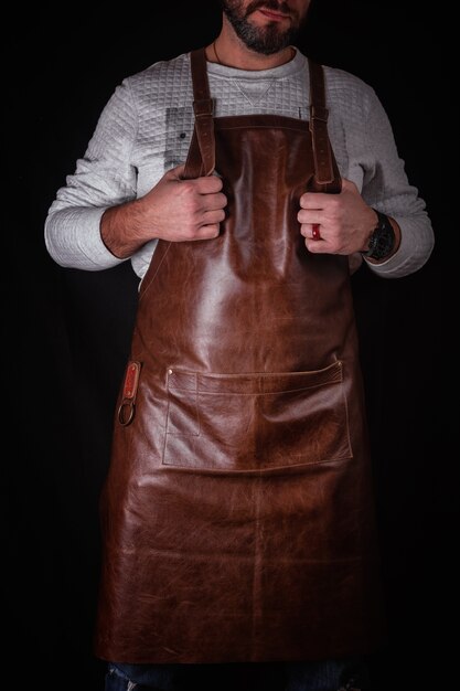 Download Premium Photo A Man In A Leather Apron