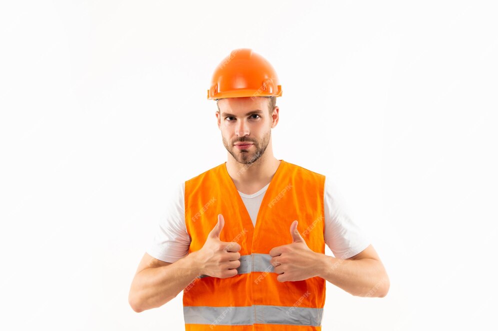 Premium Photo | Man in orange reflective vest and helmet show thumb up ...