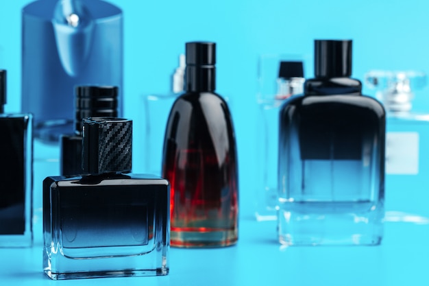 Premium Photo | Man perfume bottle on blue close up