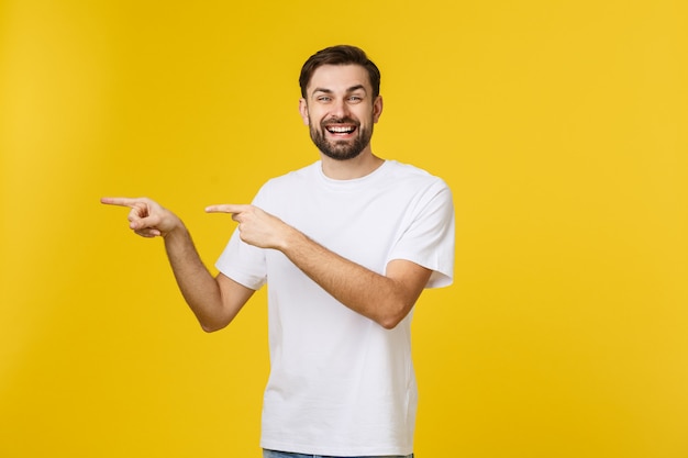Man pointing showing copy space isolated. casual handsome caucasian young man. Premium Photo