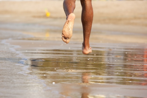 running barefoot on beach