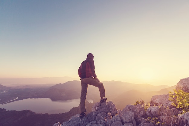 Premium Photo | Man on the sheer cliff