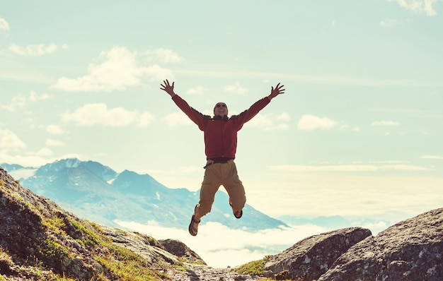 Premium Photo | Man on the sheer cliff