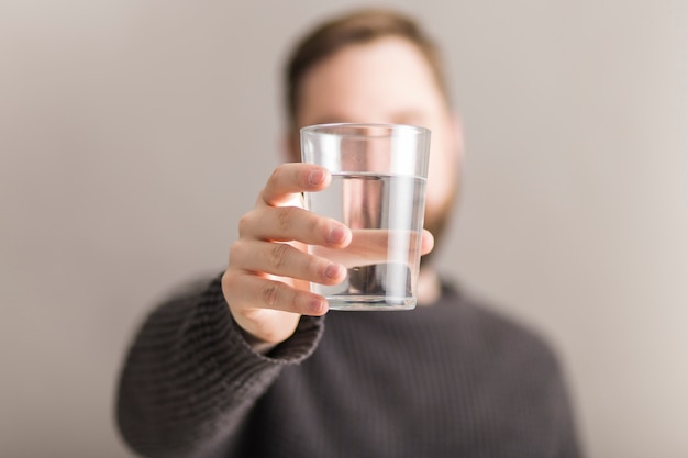 Man showing glass of water Premium Photo