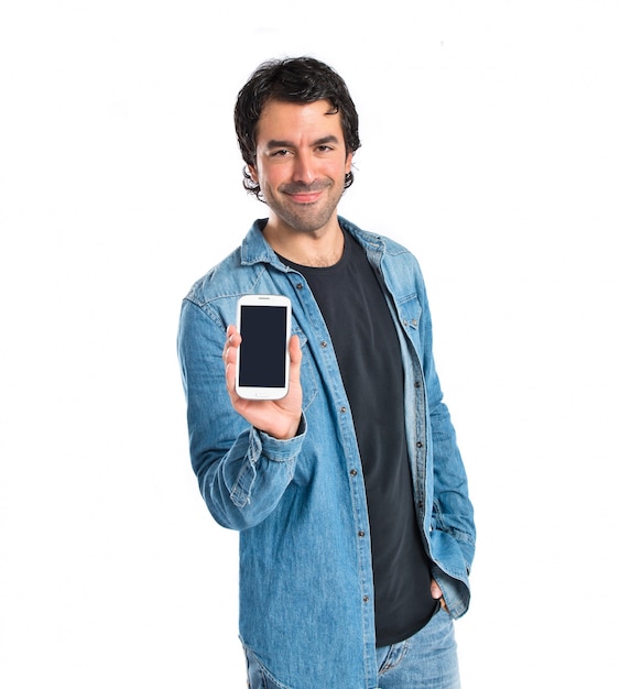 Man showing his mobile over white background | Free Photo