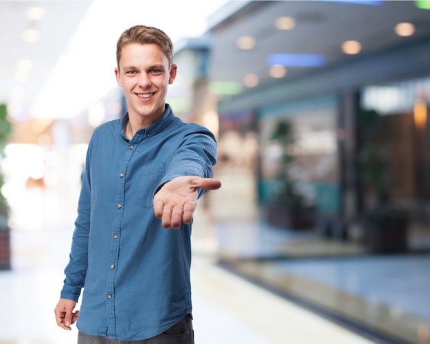 Man smiling offering his hand Photo | Free Download